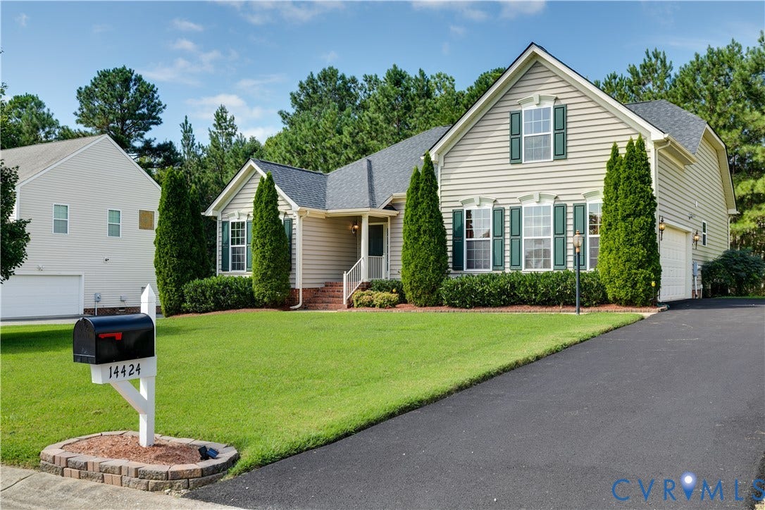 Beautifully Landscaped Front Exterior - Newly Paved Driveway.