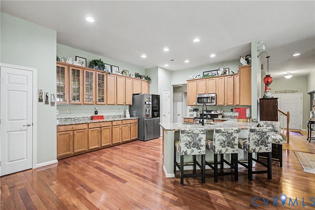 Kitchen Featuring HW Floors, Recessed Lighting and Large Island.