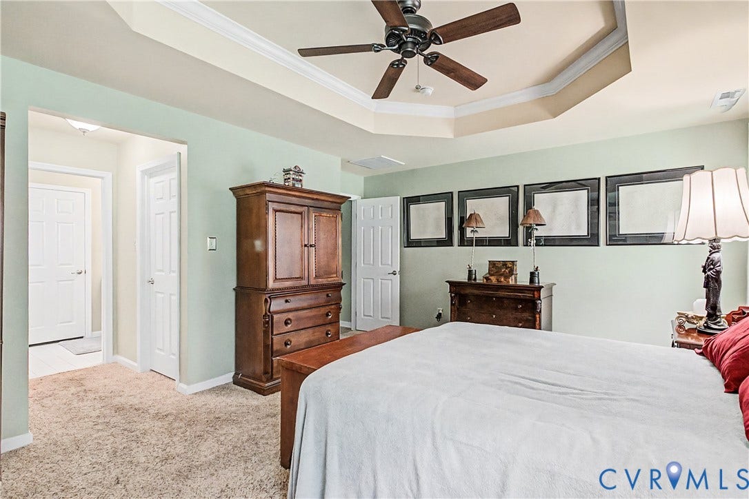 Primary Bedroom Featuring Walk-In Closets and En-Suite Bath.