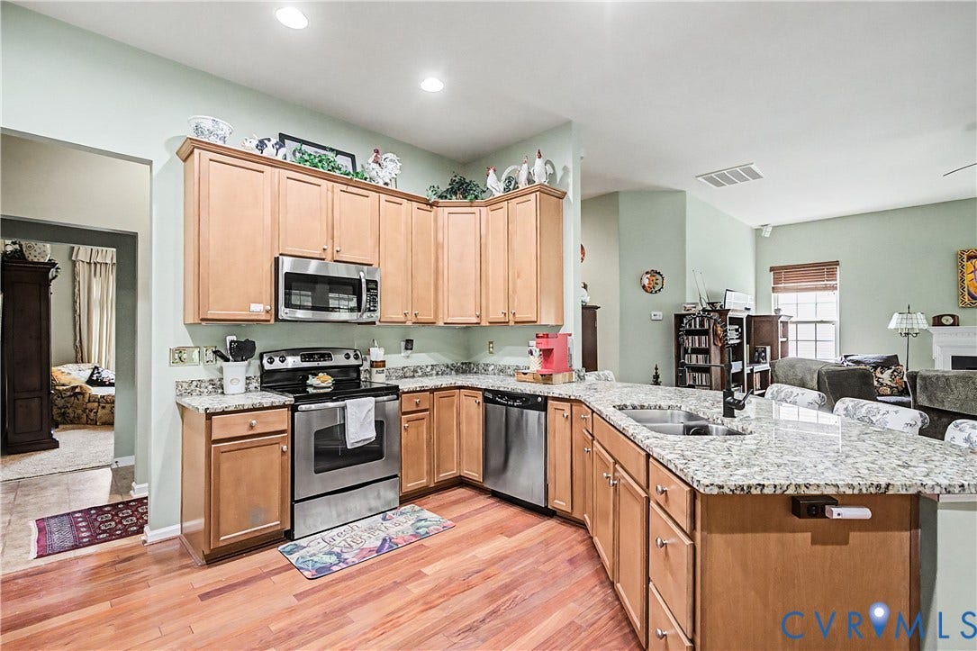 Kitchen Featuring Granite Countertops and Stainless-Steel Appliances.