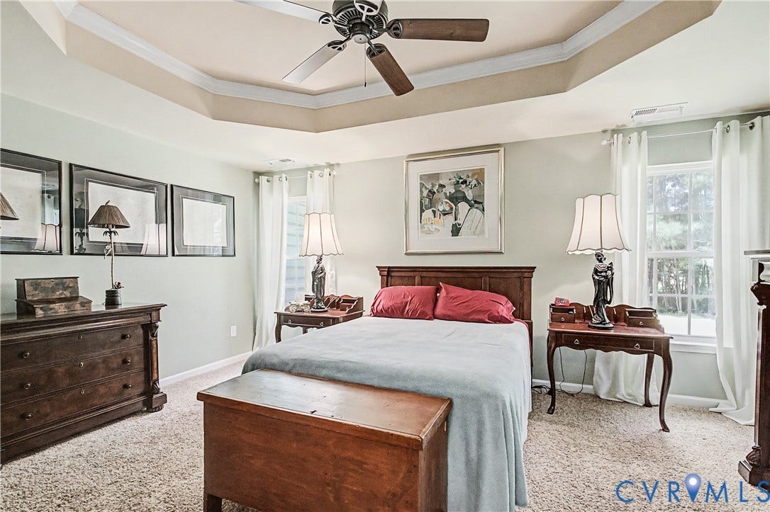 Primary Bedroom Featuring Carpet and Ceiling Fan.