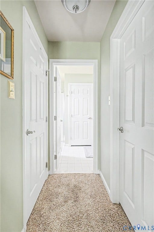 Primary Bedroom Walk-in Closets - Leads to En-Suite Bath.
