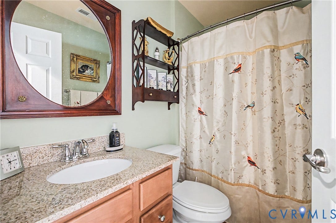 Full Bathroom Featuring Shower/Tub Combo.