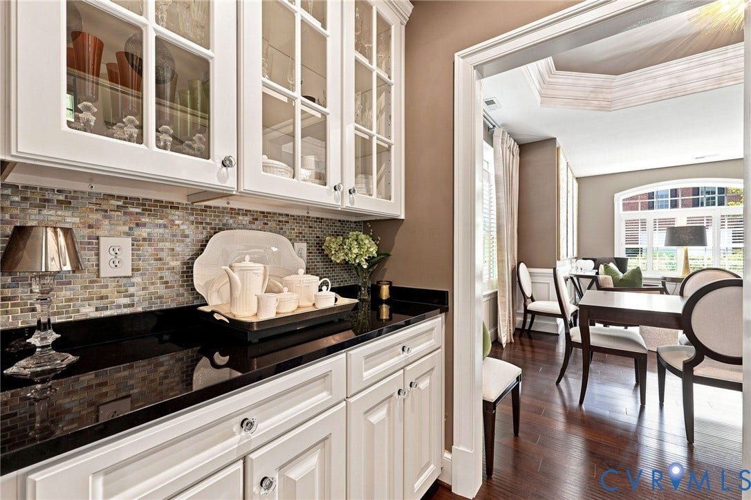 11762 Triple Notch Terrace, Three Notch Place, Henrico, VA 23233 White cabinetry with glass-front uppers, dark countertops, and a mosaic tile backsplash