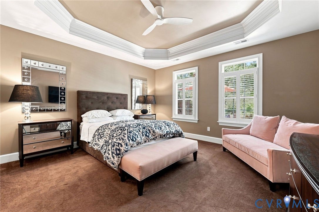 11762 Triple Notch Terrace, Three Notch Place, Henrico, VA 23233 Tray ceiling with crown molding, ceiling fan, two windows with plantation shutters, mirrored dresser, and wall-to-wall carpeting