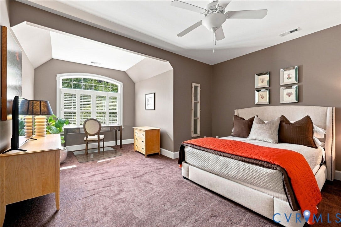 11762 Triple Notch Terrace, Three Notch Place, Henrico, VA 23233 2nd ensuite primary bedroom on level 2, with arched window (with shutters and solar film), 9' ceilings, ceiling fan/light, and carpet flooring