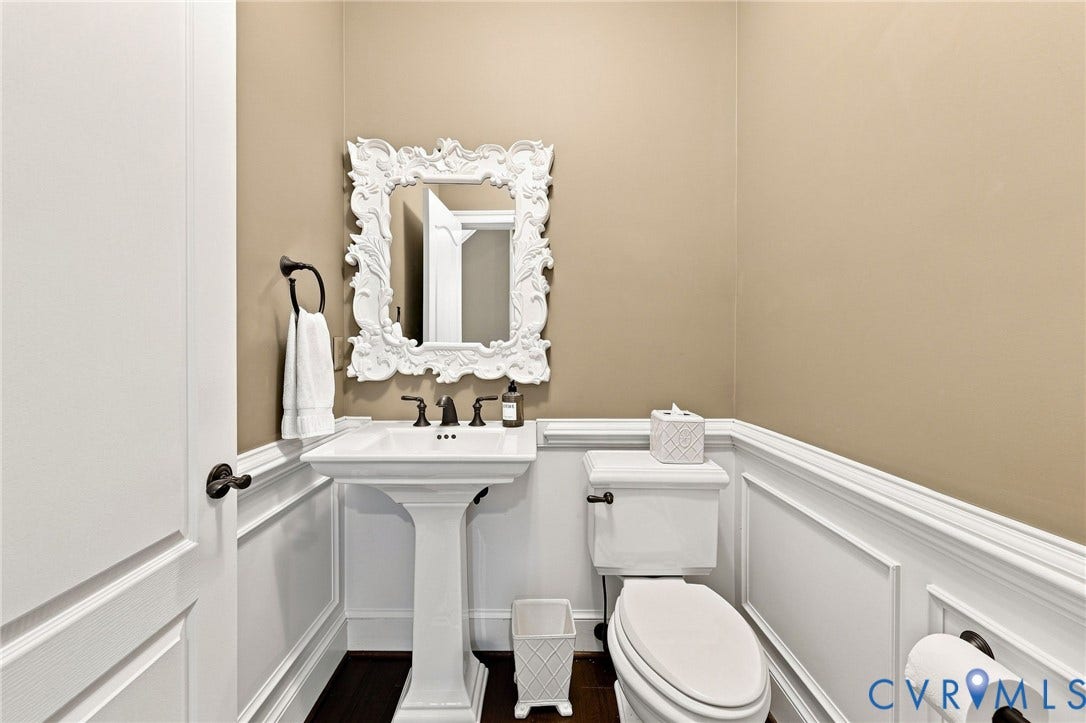 11762 Triple Notch Terrace, Three Notch Place, Henrico, VA 23233 Pedestal sink with dark-toned fixtures, ornate framed mirror, and wainscoting