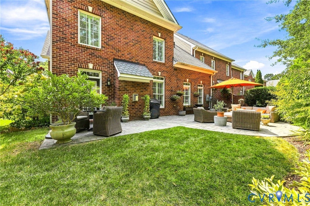 11762 Triple Notch Terrace, Three Notch Place, Henrico, VA 23233 Brick exterior with extended paver patio, lush landscaping, and brick side privacy wall