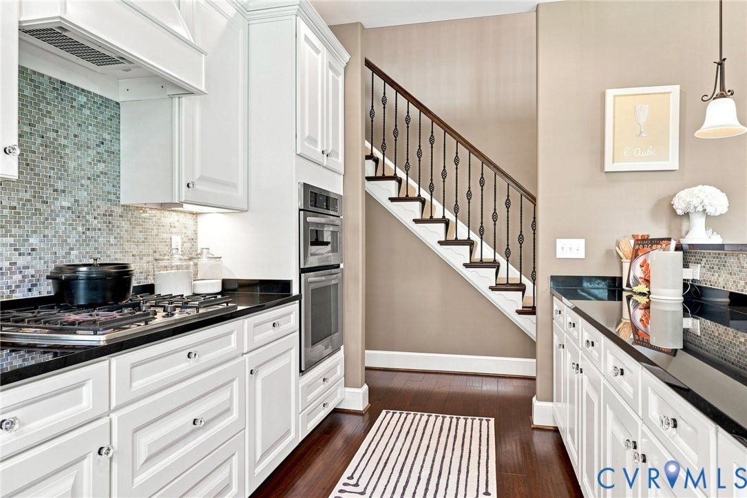 11762 Triple Notch Terrace, Three Notch Place, Henrico, VA 23233 White cabinetry with polished hardware, dark countertops, a mosaic tile backsplash, built-in double ovens, and wood-finish flooring