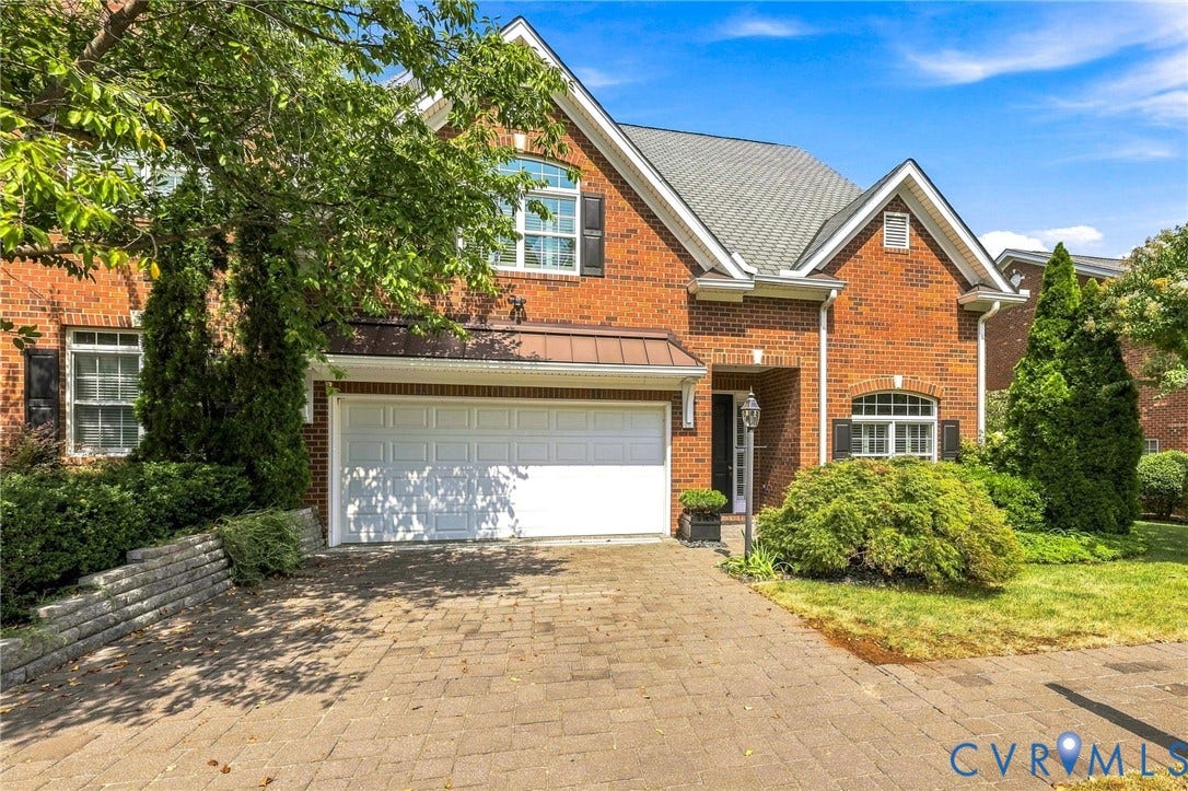 11762 Triple Notch Terrace, Three Notch Place, Henrico, VA 23233 Brick exterior with a gabled roofline, two-car garage, and a paver driveway