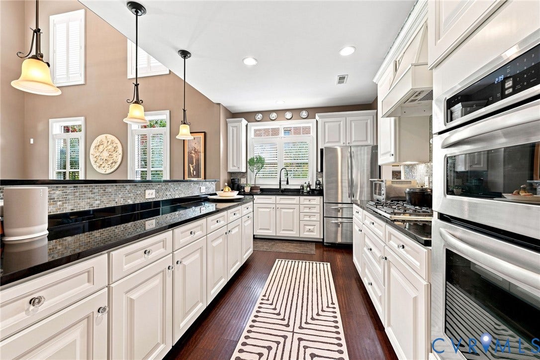 11762 Triple Notch Terrace, Three Notch Place, Henrico, VA 23233 Kitchen featuring white cabinetry, dark countertops, a mosaic tile backsplash, stainless steel appliances, and wood-finish flooring