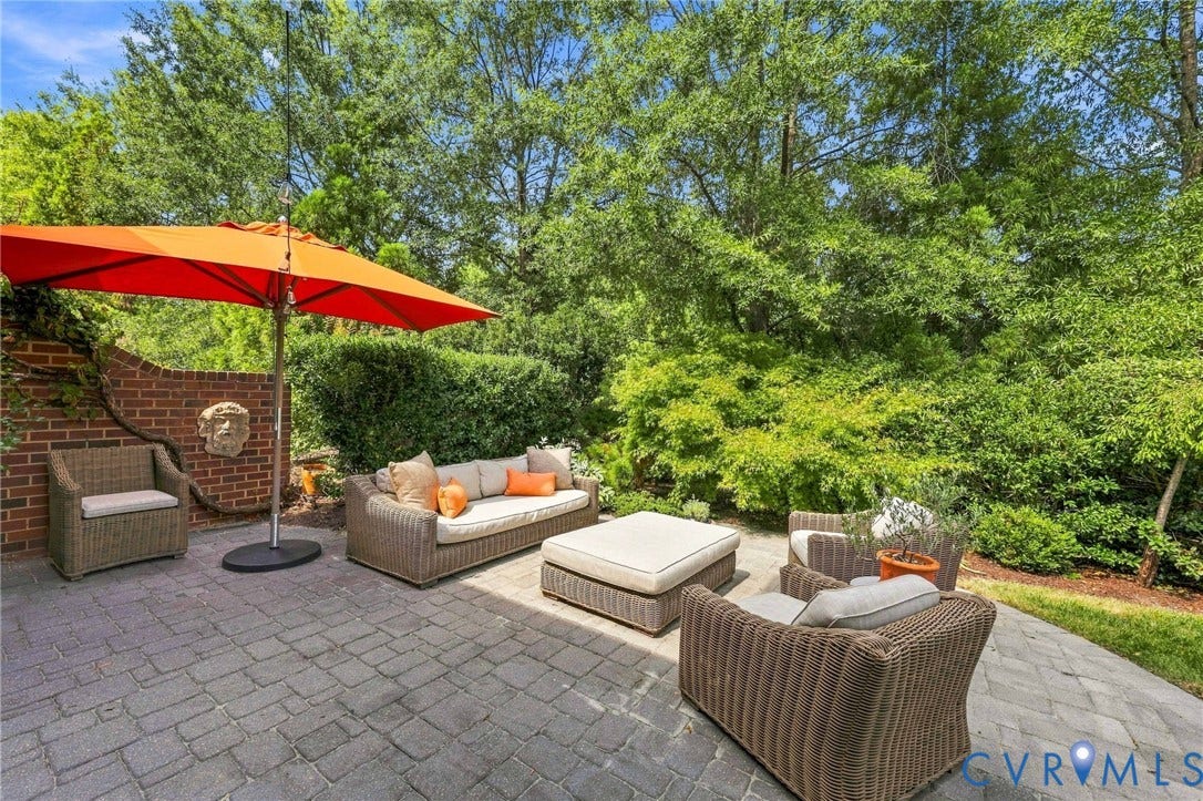 11762 Triple Notch Terrace, Three Notch Place, Henrico, VA 23233 Brick paver patio, brick retaining wall, mature perimeter landscaping, and decorative wall-mounted sculptural element