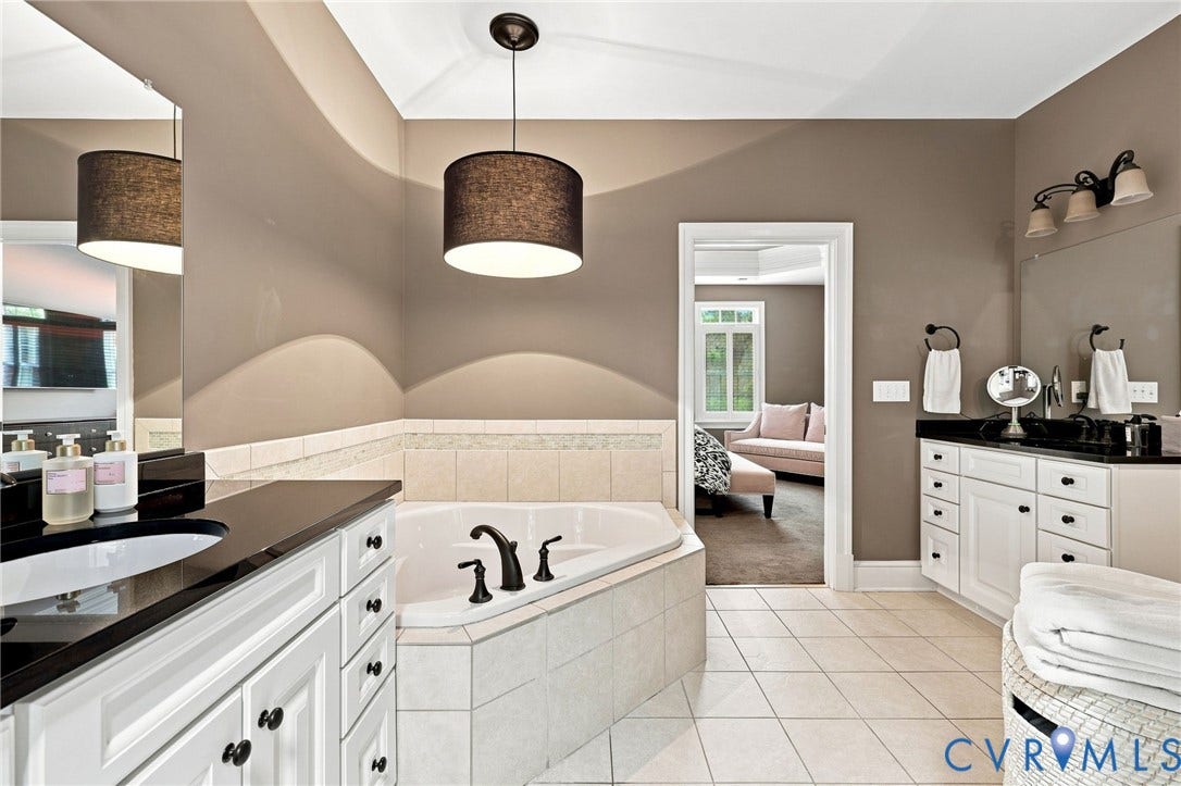 11762 Triple Notch Terrace, Three Notch Place, Henrico, VA 23233 Corner soaking tub with tiled surround, dual vanity with undermount sinks, and ceramic tile flooring