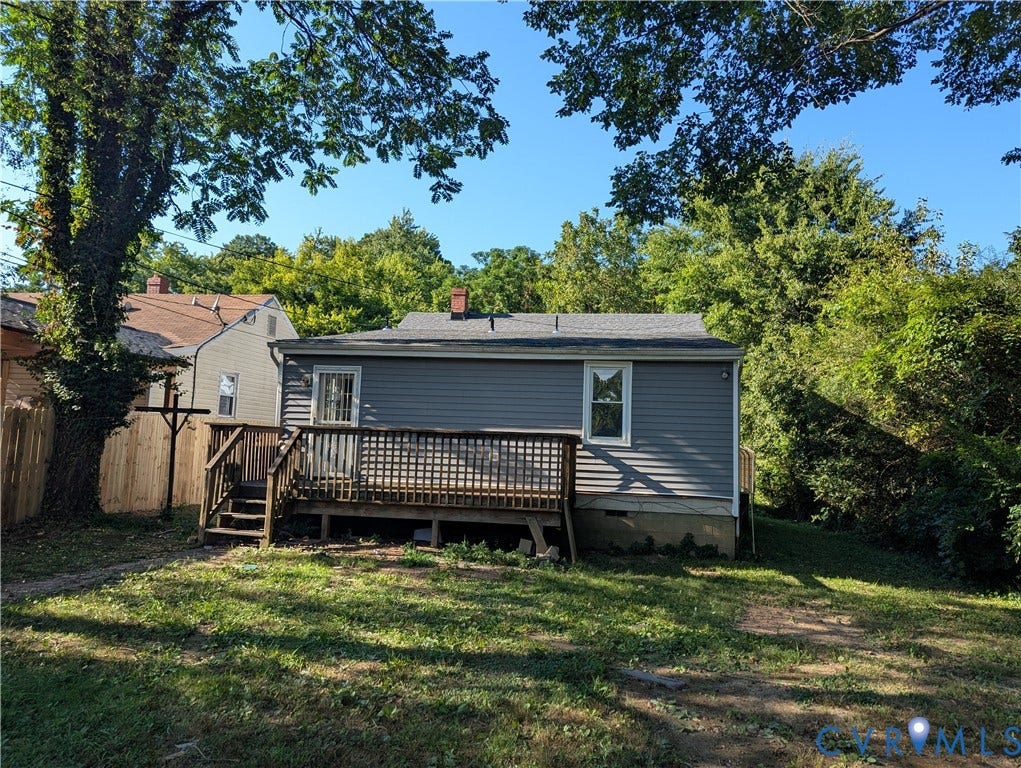 2218 Concord Avenue, Richmond, VA 23234 Expansive backyard with a wooden deck featuring a multi-level staircase