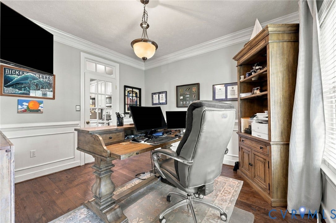 8301 Macandrew Terrace, Chesterfield, VA 23838 Hardwood flooring, crown molding, wainscoting, glass-paneled door, and a built-in wood cabinet