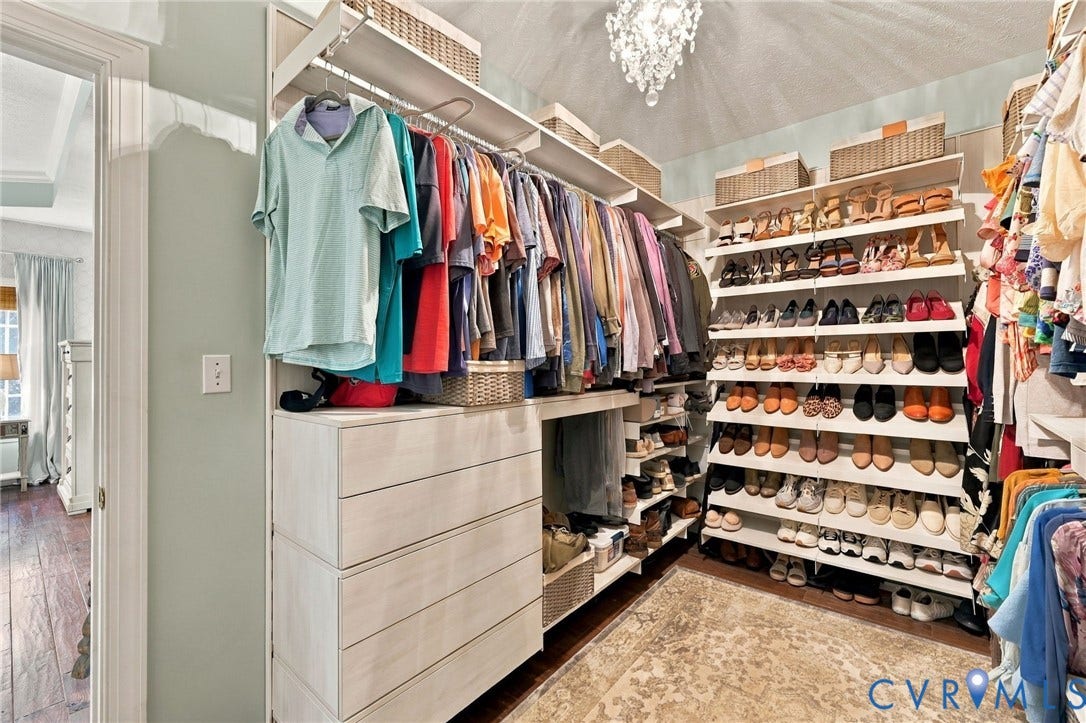 8301 Macandrew Terrace, Chesterfield, VA 23838 Custom closet system featuring multiple hanging rods, extensive shelving, and built-in drawers