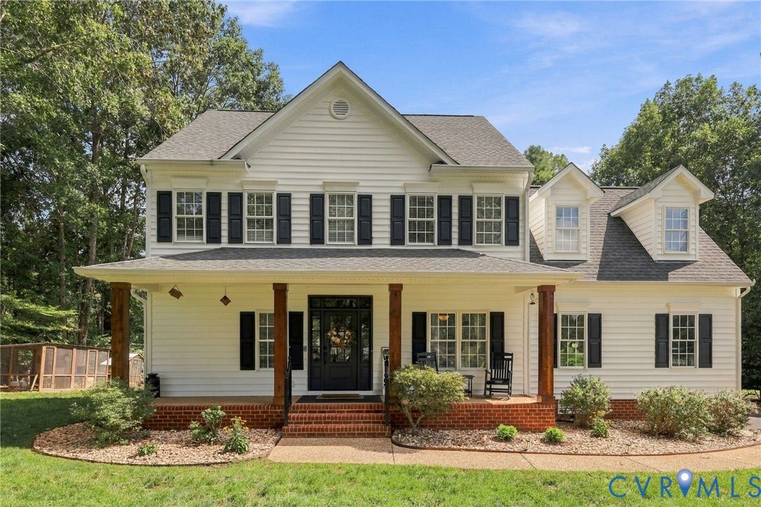 8301 Macandrew Terrace, Chesterfield, VA 23838 Siding exterior with multiple dormers, covered front porch with wood-finish columns, brick foundation, and dark window shutters