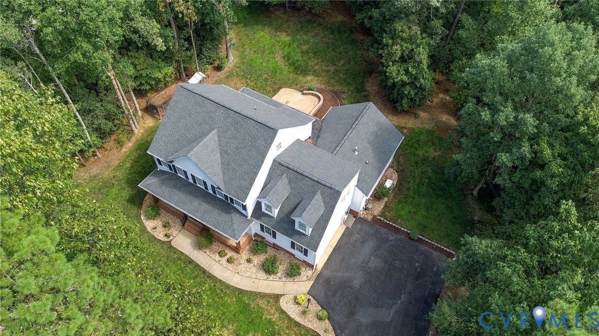 8301 Macandrew Terrace, Chesterfield, VA 23838 White two-story exterior with a gray shingle roof and dormer windows