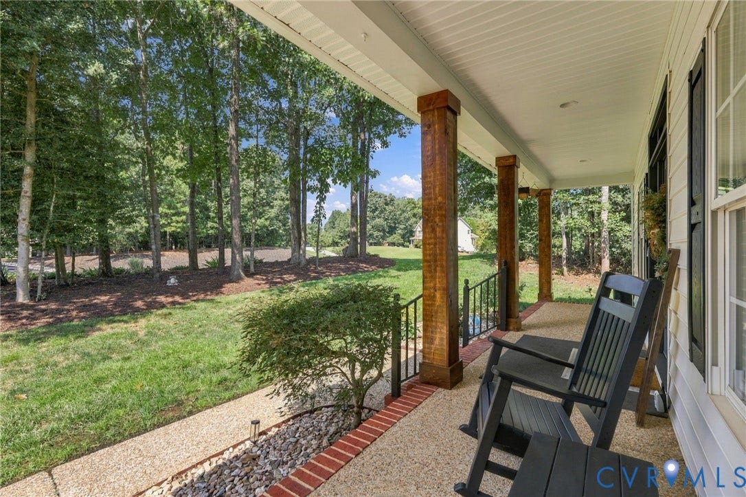 8301 Macandrew Terrace, Chesterfield, VA 23838 Expansive covered front porch with wood-finish columns, exposed aggregate flooring