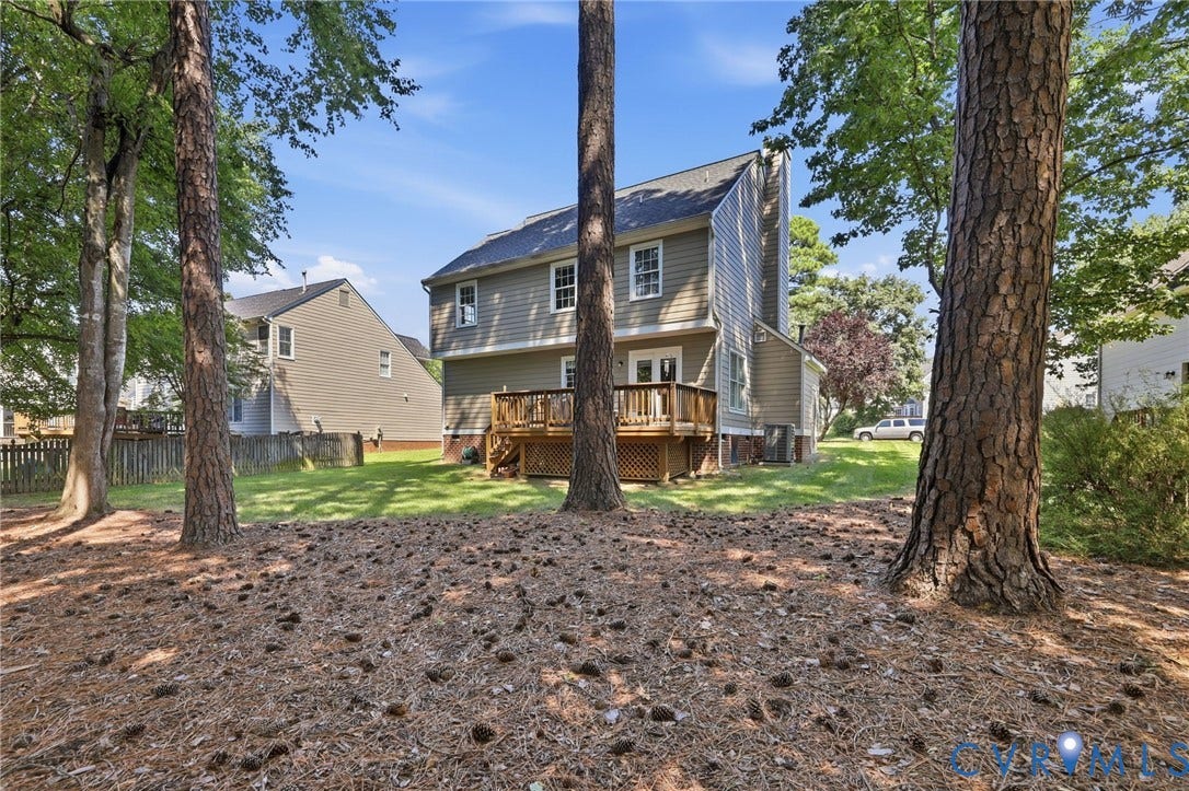12309 Maybrook Lane, Wyndham, Glen Allen, VA 23059 Expansive rear yard featuring mature trees, a wood deck, and a grass lawn