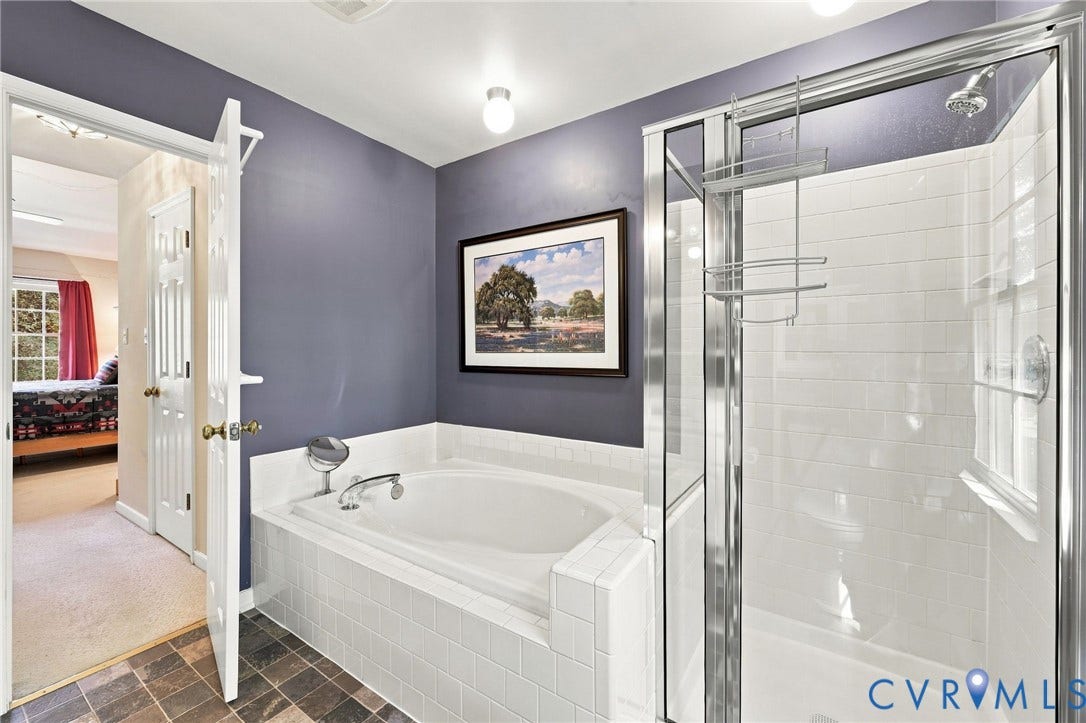 12309 Maybrook Lane, Wyndham, Glen Allen, VA 23059 Built-in soaking tub with white tile surround, glass-enclosed shower with subway tile walls, and slate-finish flooring