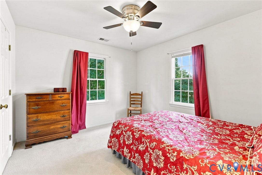 12309 Maybrook Lane, Wyndham, Glen Allen, VA 23059 Bright interior with white walls, carpet flooring, a ceiling fan with integrated lighting, and two windows