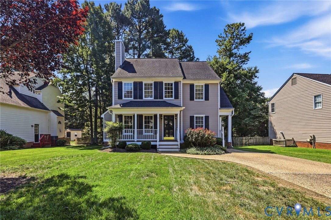 12309 Maybrook Lane, Wyndham, Glen Allen, VA 23059 Two-story residence with a covered front porch, a gray siding exterior, dark shutters, and a prominent chimney