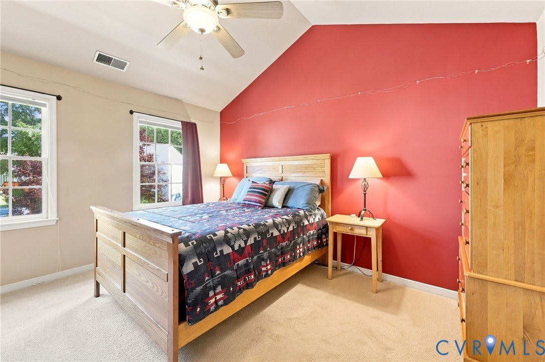 12309 Maybrook Lane, Wyndham, Glen Allen, VA 23059 Vaulted ceiling with a ceiling fan, two double-hung windows, and light-toned carpeting