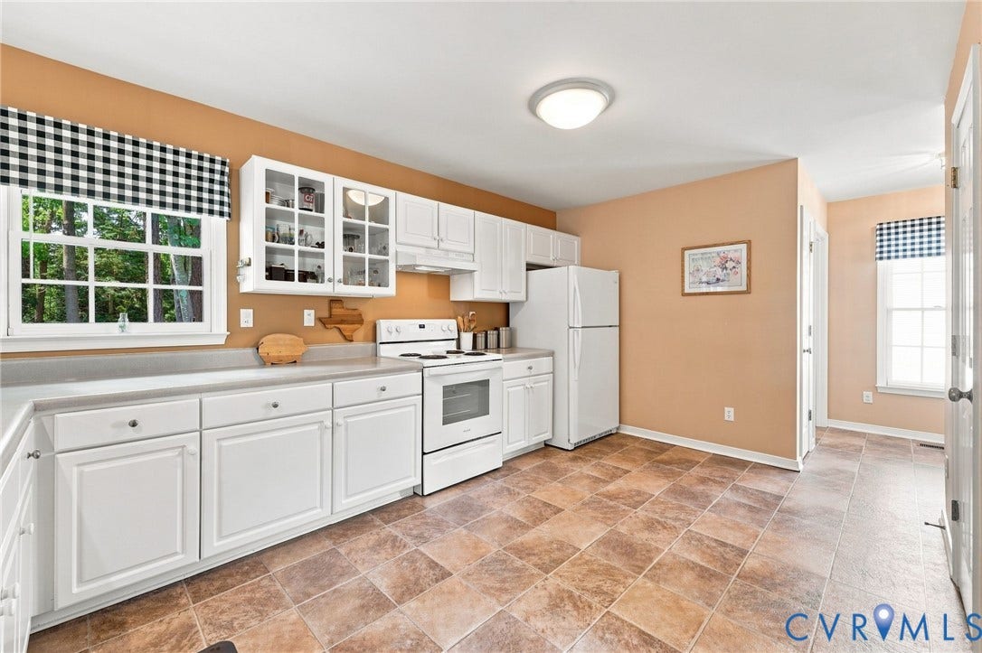 12309 Maybrook Lane, Wyndham, Glen Allen, VA 23059 Kitchen featuring extensive white cabinetry, an electric range, a full-size refrigerator, and tile flooring