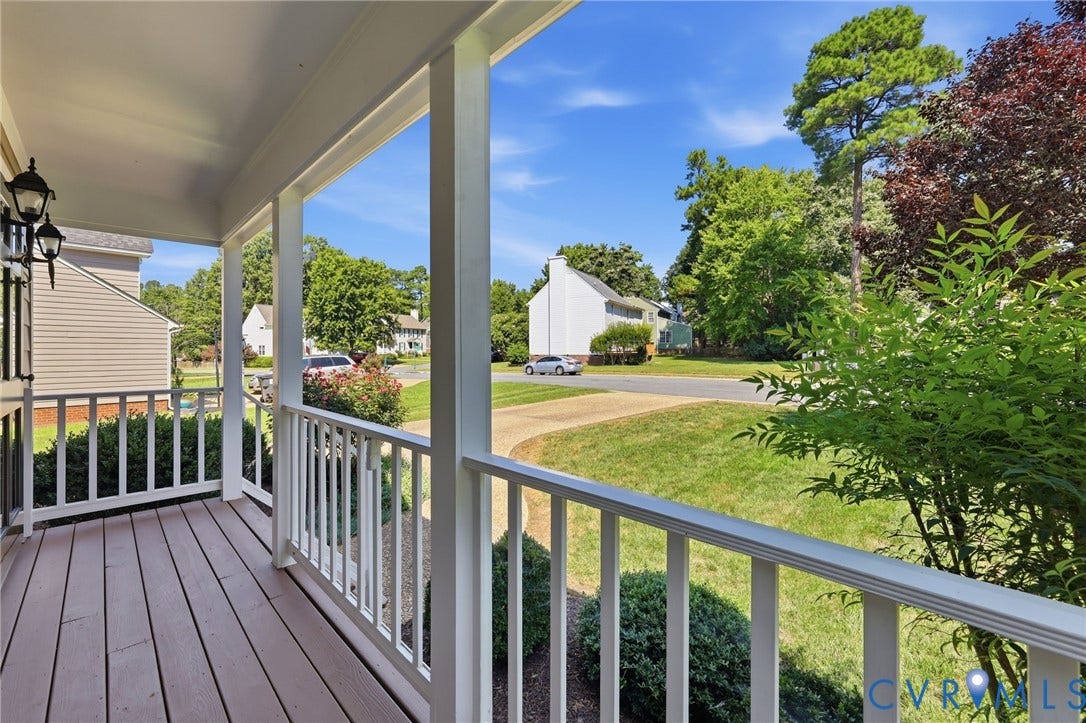 12309 Maybrook Lane, Wyndham, Glen Allen, VA 23059 Covered front porch with wood-finish flooring, white railing, and exterior wall sconces