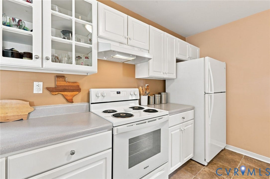 12309 Maybrook Lane, Wyndham, Glen Allen, VA 23059 White cabinetry with glass-front upper cabinets, light gray countertops, white electric range, white refrigerator, and tile flooring