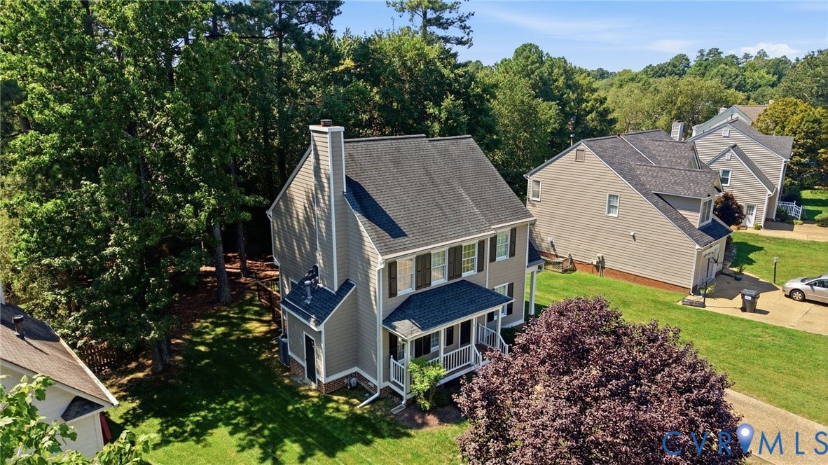 12309 Maybrook Lane, Wyndham, Glen Allen, VA 23059 Two-story residence featuring siding exterior, a front porch, and a prominent chimney