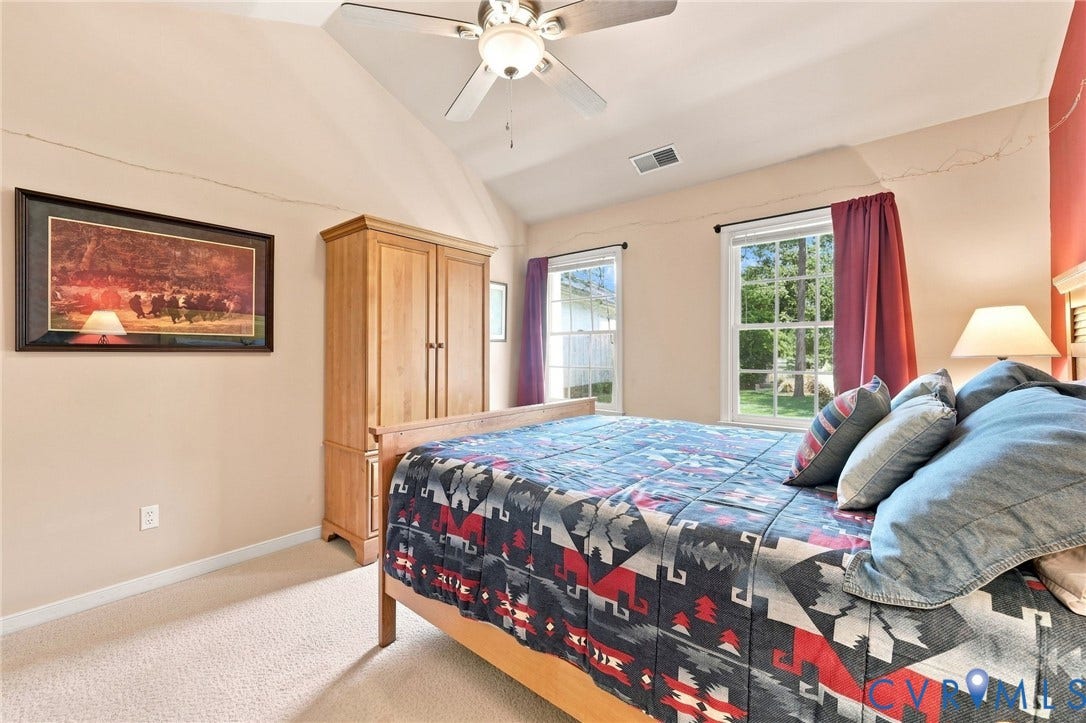 12309 Maybrook Lane, Wyndham, Glen Allen, VA 23059 Vaulted ceiling, ceiling fan, two windows, wall-to-wall carpeting, and wood-finish door frame