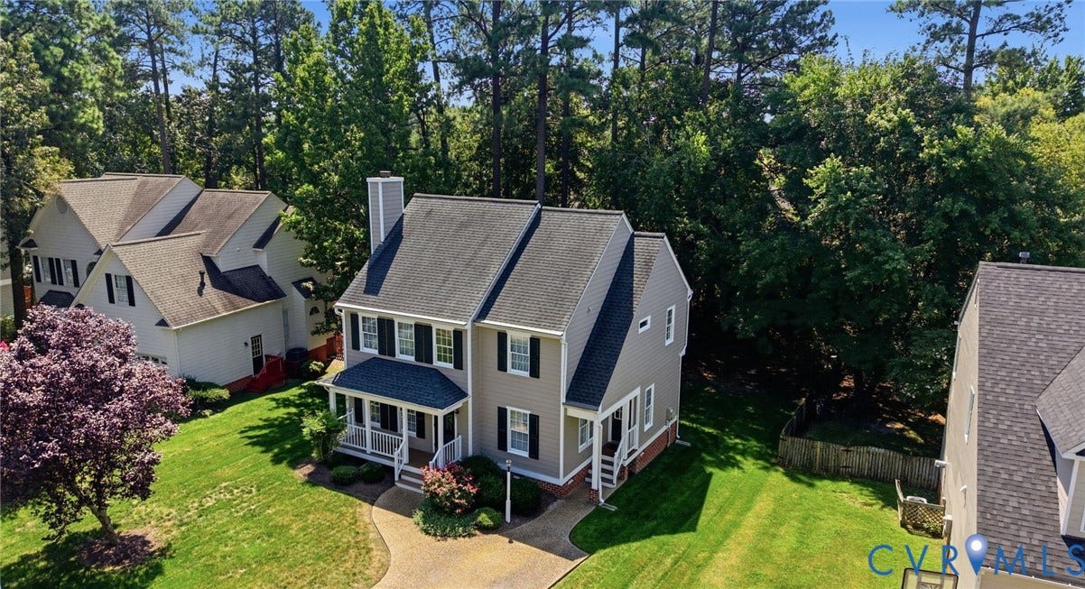 12309 Maybrook Lane, Wyndham, Glen Allen, VA 23059 Two-story exterior with a covered porch, an attached chimney, and a paved driveway