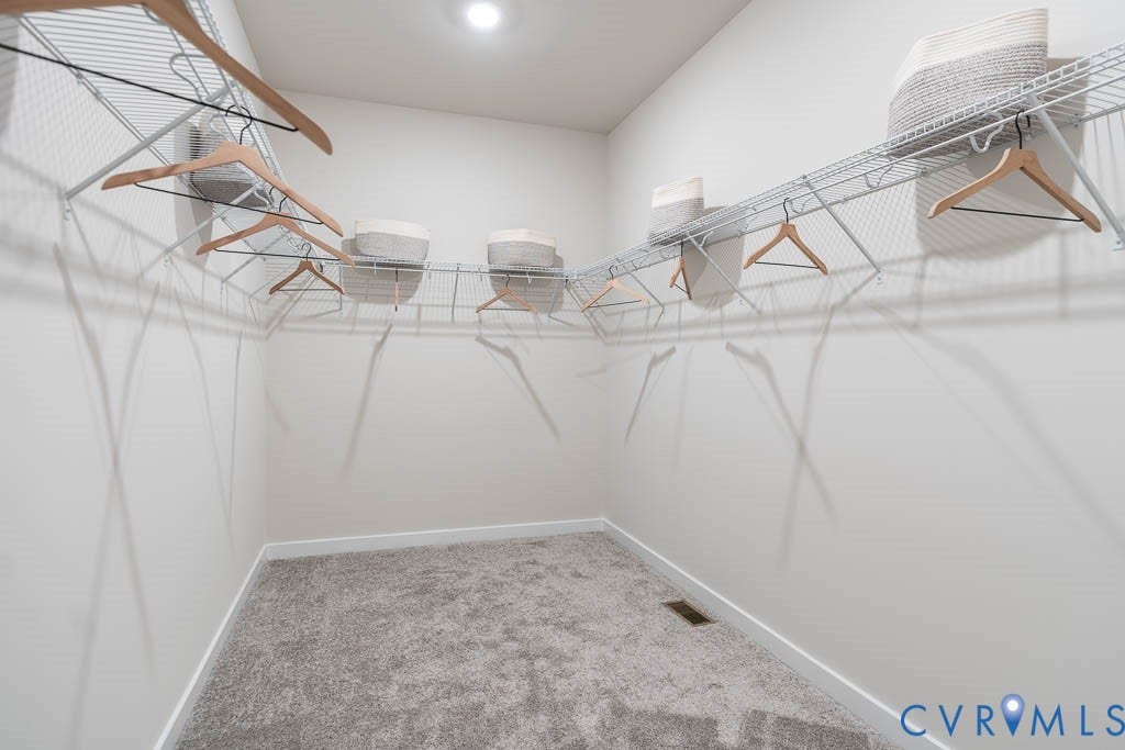 16056 Greenhart Drive, Chesterfield, VA 23832 Recessed lighting illuminates a carpeted closet featuring built-in wire shelving