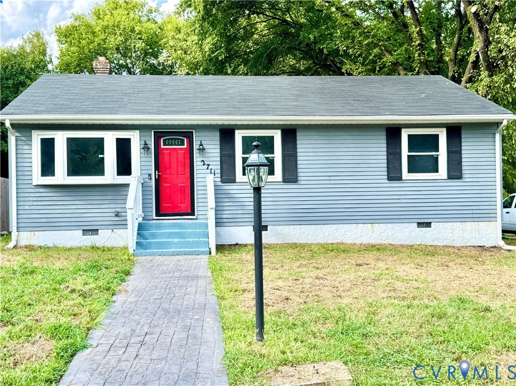 2711 Cheatham Street, Henderson & Johnson, Richmond, VA 23234 Light blue siding exterior with a red entry door, white trim, and black shutters