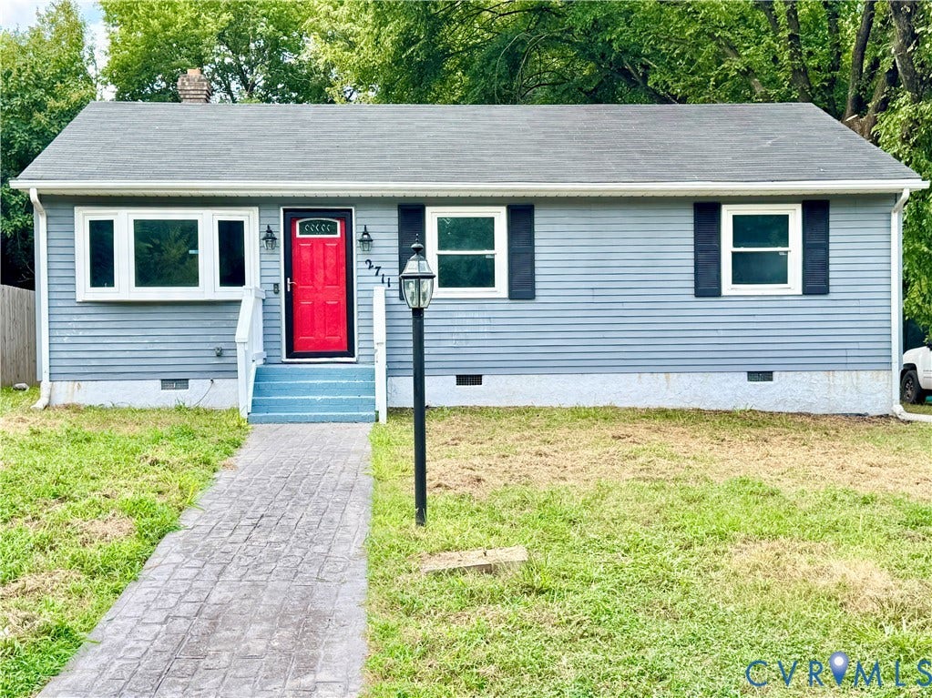 2711 Cheatham Street, Henderson & Johnson, Richmond, VA 23234 Gray siding exterior with a red front door, white trim windows, black shutters, and a stamped concrete walkway