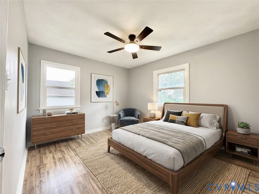 2711 Cheatham Street, Henderson & Johnson, Richmond, VA 23234 Wood-finish flooring, white trim, two windows, and a ceiling fan with integrated lighting