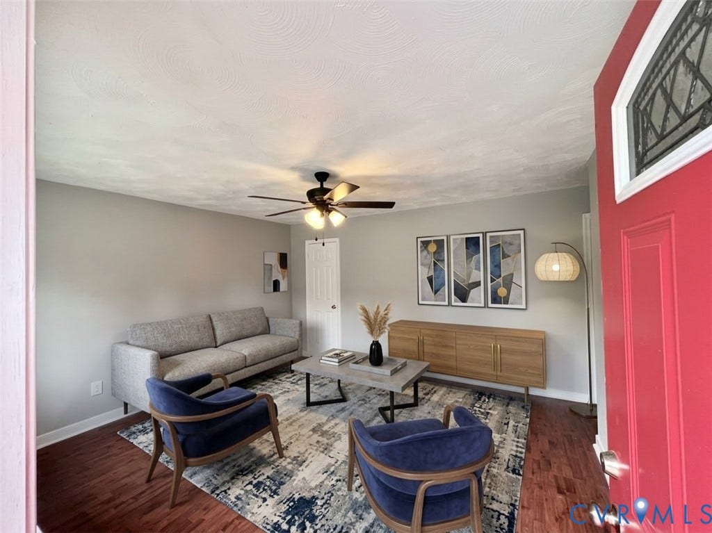 2711 Cheatham Street, Henderson & Johnson, Richmond, VA 23234 Wood-finish flooring, ceiling fan with integrated lighting, and a white interior door