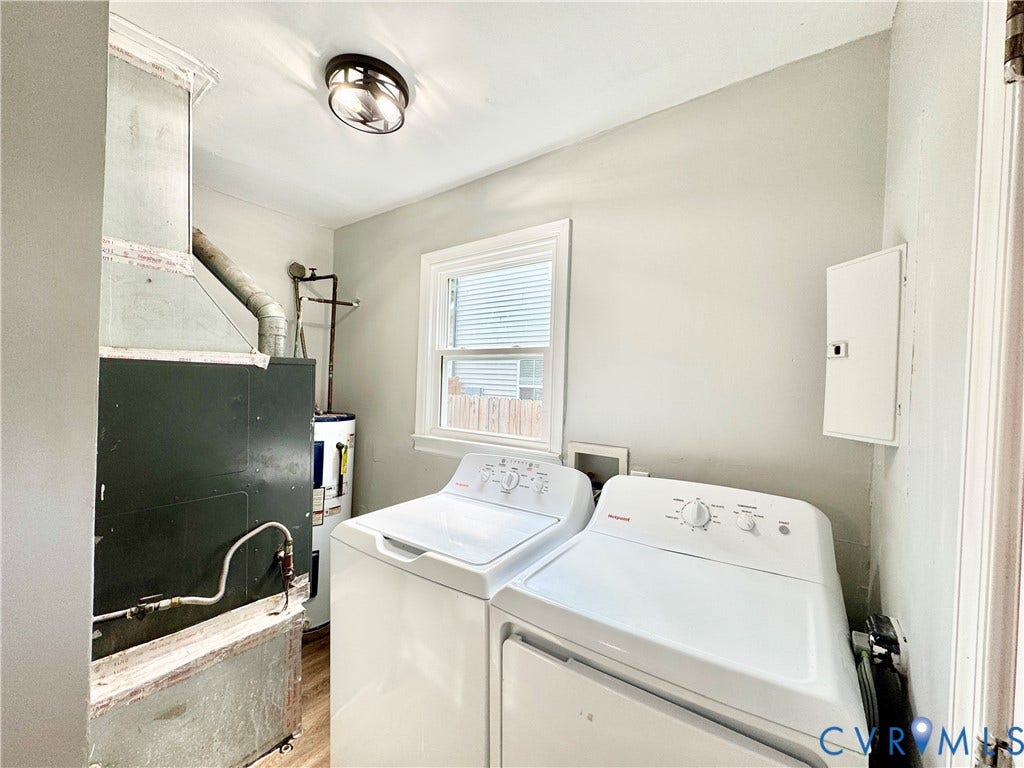 2711 Cheatham Street, Henderson & Johnson, Richmond, VA 23234 Utility space featuring a window, wood-finish flooring, and a ceiling-mounted light fixture