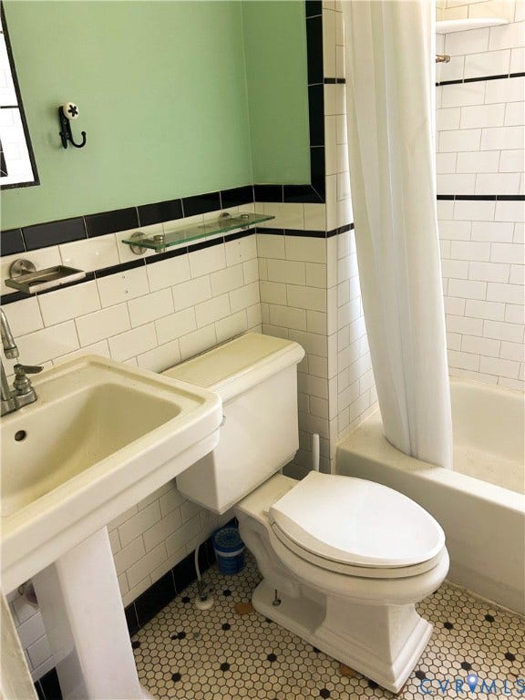 2709 E Clay Street, Church Hill, Richmond, VA 23223 Pedestal sink with chrome fixtures, subway tile walls, hexagon mosaic tile flooring, and a built-in bathtub