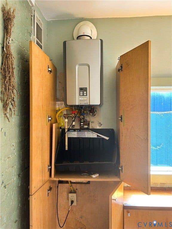 2709 E Clay Street, Church Hill, Richmond, VA 23223 Tankless water heater installation within wood-finish cabinetry