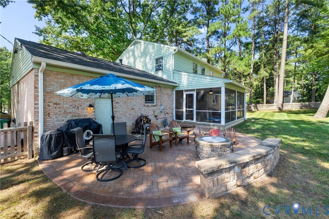 1109 Swissvale Place, Henrico, VA 23229 Brick paver patio with a stone fire pit and built-in seating