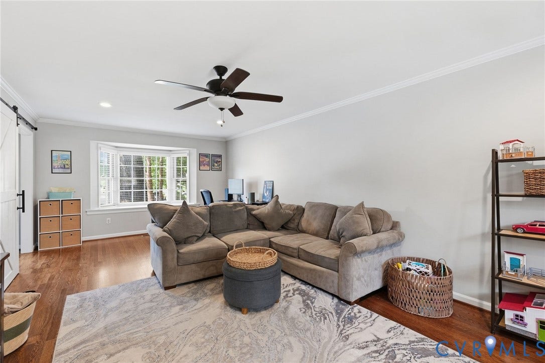 1109 Swissvale Place, Henrico, VA 23229 Hardwood flooring, bay window, white crown molding, recessed lighting, and a ceiling fan with light fixture