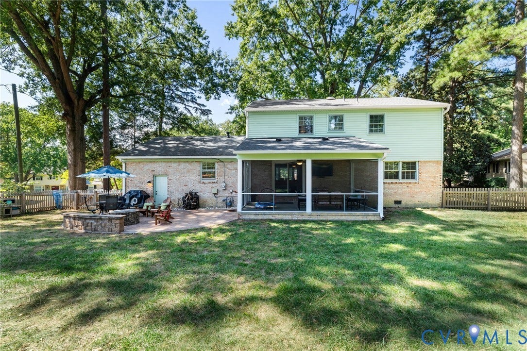 1109 Swissvale Place, Henrico, VA 23229 Screened porch, brick exterior, rear patio, and wood fencing