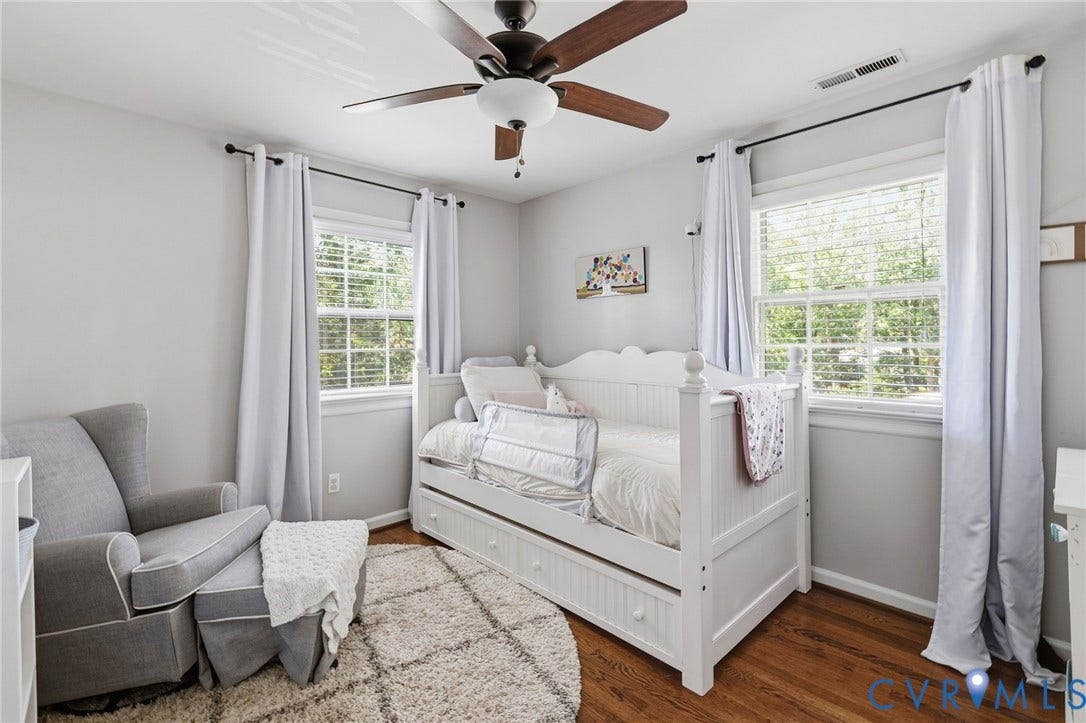 1109 Swissvale Place, Henrico, VA 23229 Hardwood flooring, painted walls, two windows, ceiling fan with light fixture, and a built-in daybed with pull-out storage