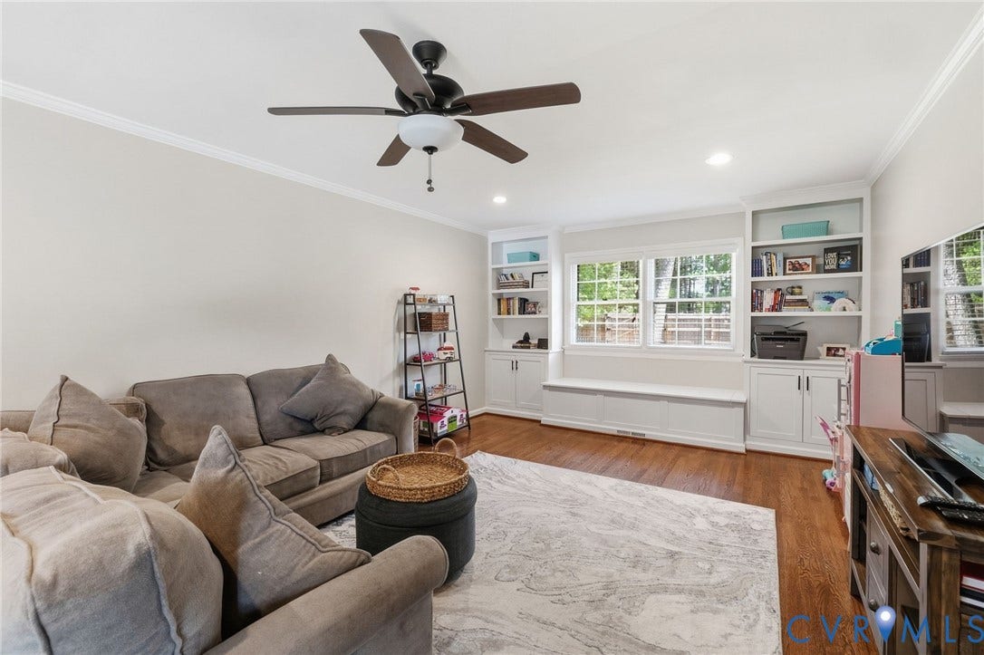 1109 Swissvale Place, Henrico, VA 23229 Built-in shelving, window bench seating, wood-finish flooring, and crown molding