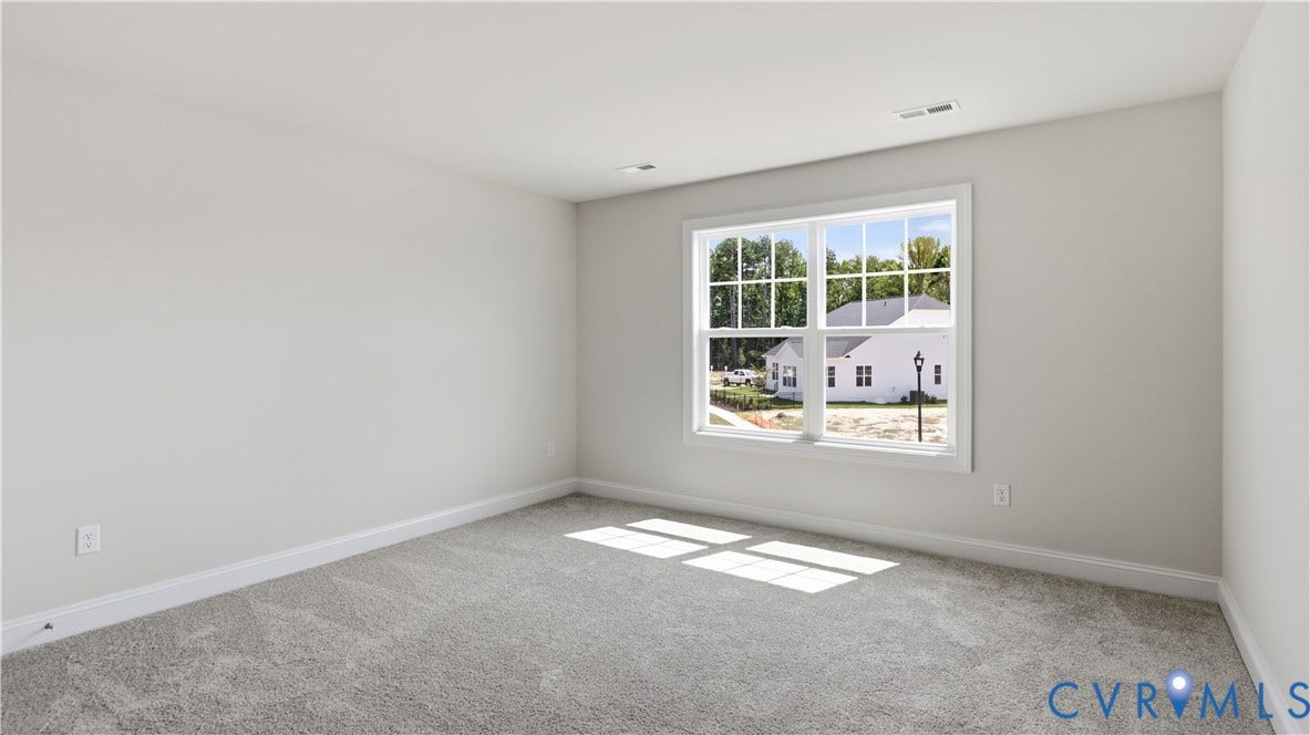 12344 Garnet Parke Circle, Short Pump Area, Glen Allen, VA 23059 Neutral wall paint, light gray carpeting, and a multi-pane window