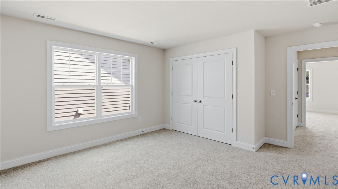 12344 Garnet Parke Circle, Short Pump Area, Glen Allen, VA 23059 Light-colored wall-to-wall carpeting, white trim, dual-pane window, paneled bifold doors, and neutral wall color