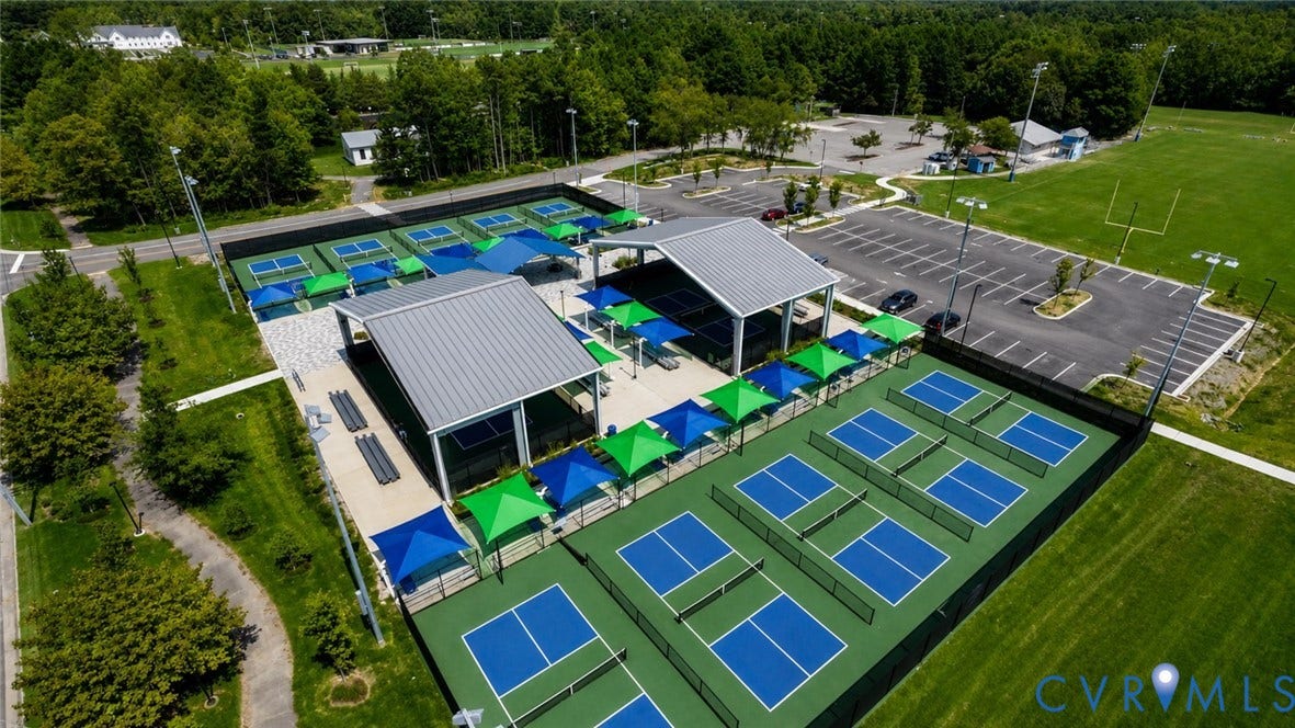 12344 Garnet Parke Circle, Short Pump Area, Glen Allen, VA 23059 Multiple pickleball courts with perimeter fencing, two large covered pavilions, and an expansive paved parking area